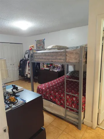 a bedroom with furniture and a fireplace