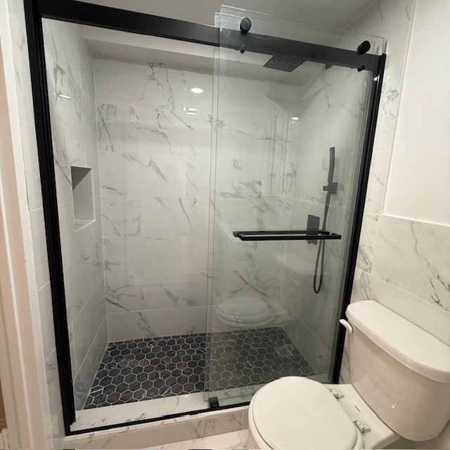 400 East 70th Street, Unit 907 Manhattan, NY 10021 - Photo 8 of 13 a bathroom with a toilet and a shower