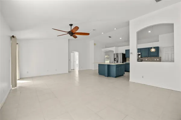 a view of a kitchen with a sink and a fireplace