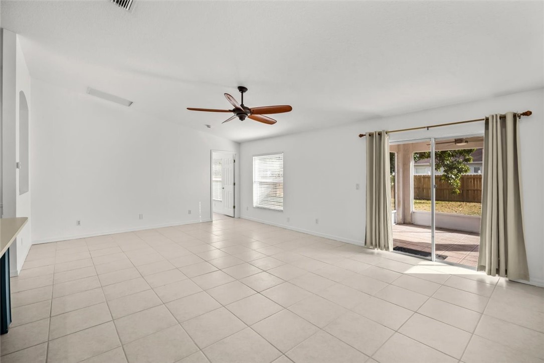 742 46th Square Vero Beach, FL 32968 - Photo 10 of 36 a view of an empty room with a window
