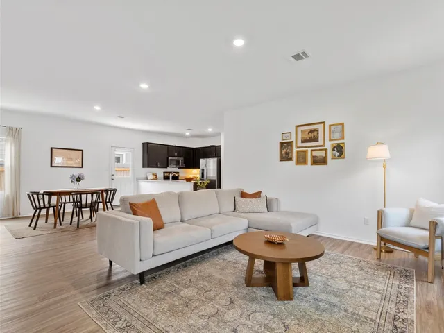 a living room with furniture and a table