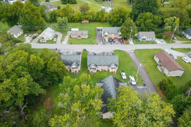 an aerial view of a house with yard swimming pool and outdoor seating