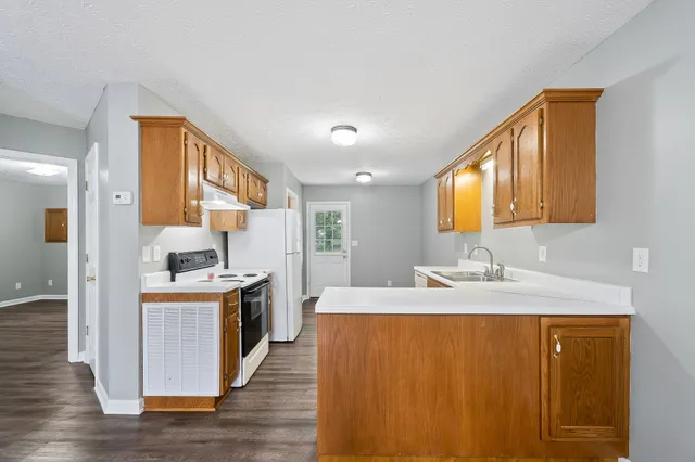 a kitchen with a stove and a sink