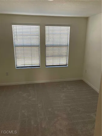 a view of a room that has a window in it