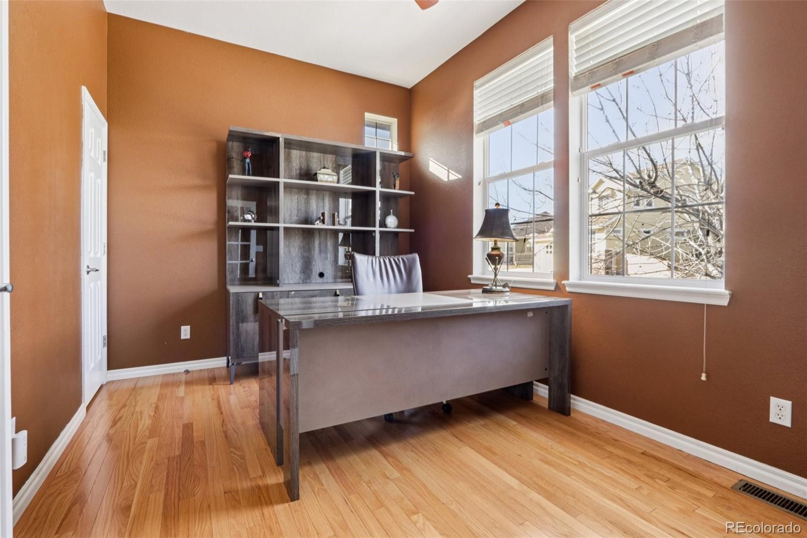 3120 Redhaven Way Highlands Ranch, CO 80126 - Photo 11 of 50 a room with window and wooden floor