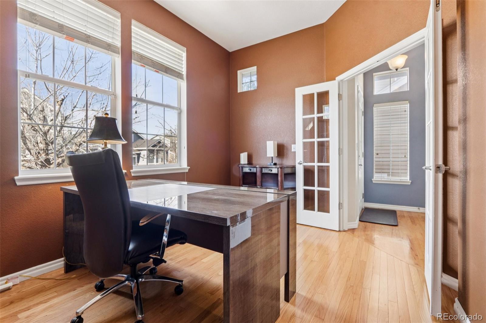 3120 Redhaven Way Highlands Ranch, CO 80126 - Photo 12 of 50 a view of a workspace with furniture and a window