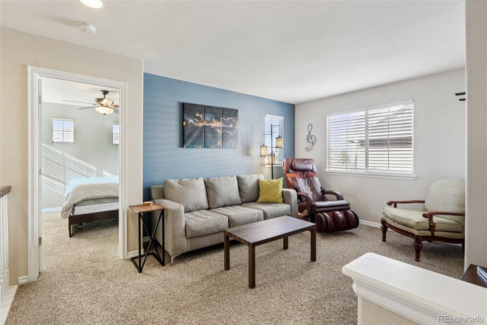 3120 Redhaven Way Highlands Ranch, CO 80126 - Photo 13 of 50 a living room with furniture and a window