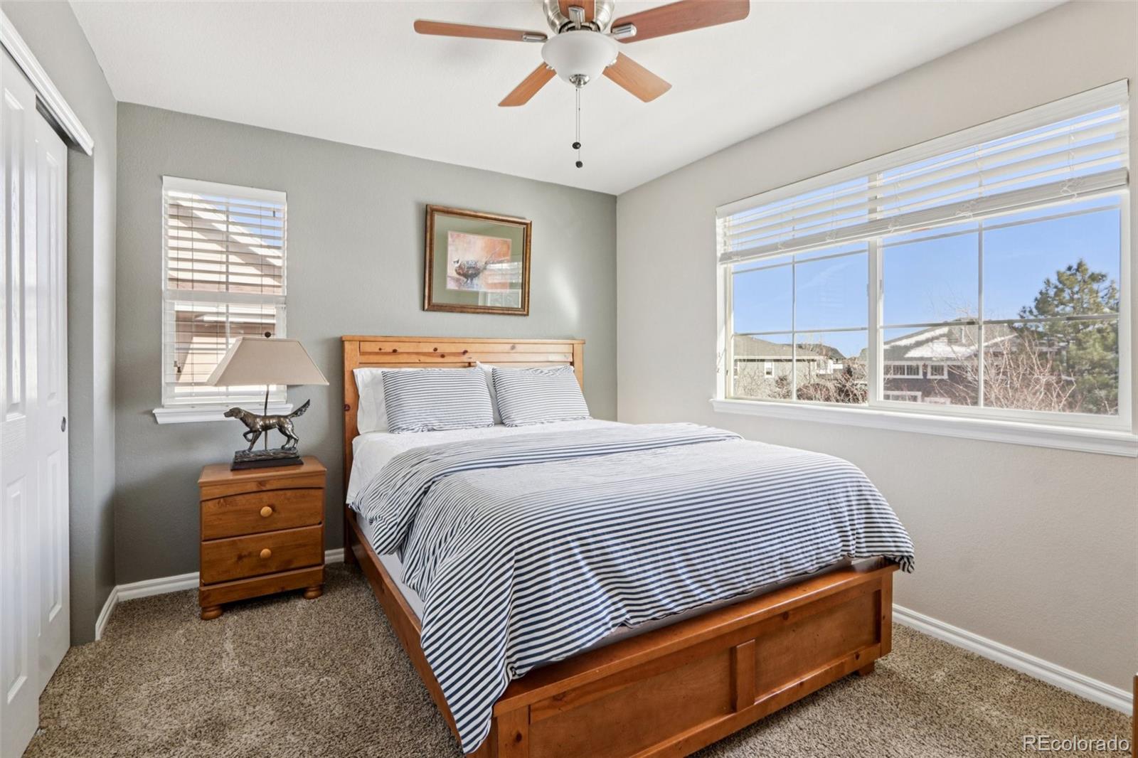 3120 Redhaven Way Highlands Ranch, CO 80126 - Photo 17 of 50 a bedroom with a bed and a window