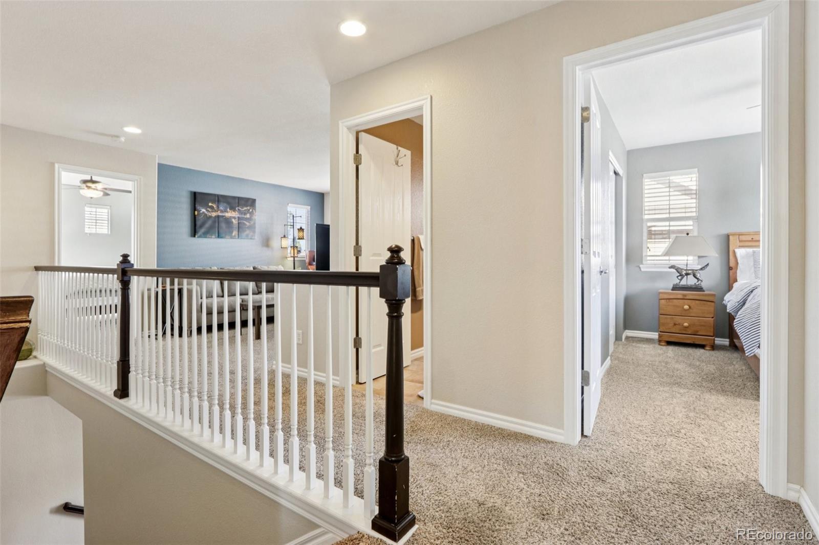 3120 Redhaven Way Highlands Ranch, CO 80126 - Photo 22 of 50 a view of a hallway with a livingroom and windows