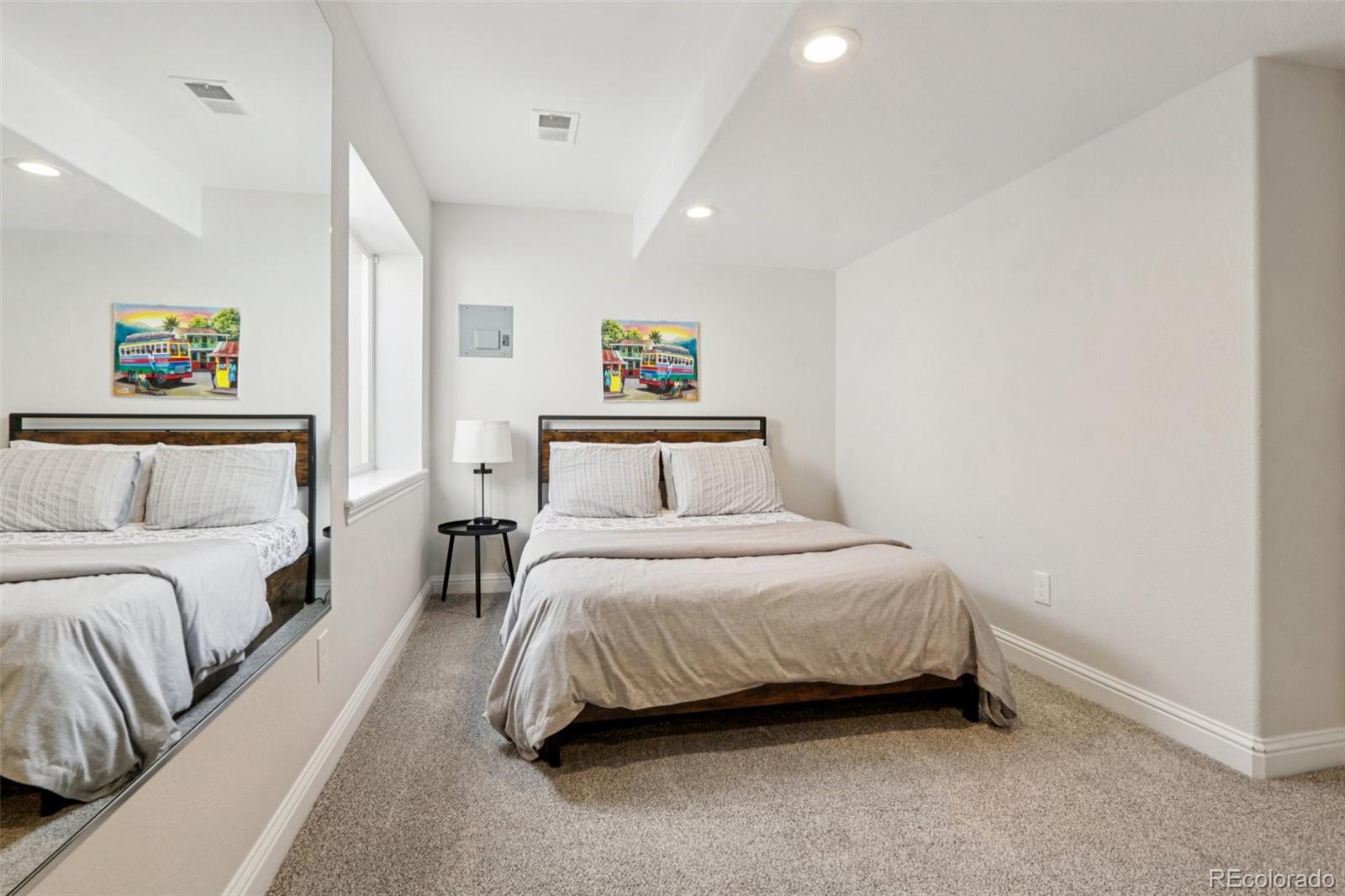 3120 Redhaven Way Highlands Ranch, CO 80126 - Photo 28 of 50 a bedroom with a bed and a couch