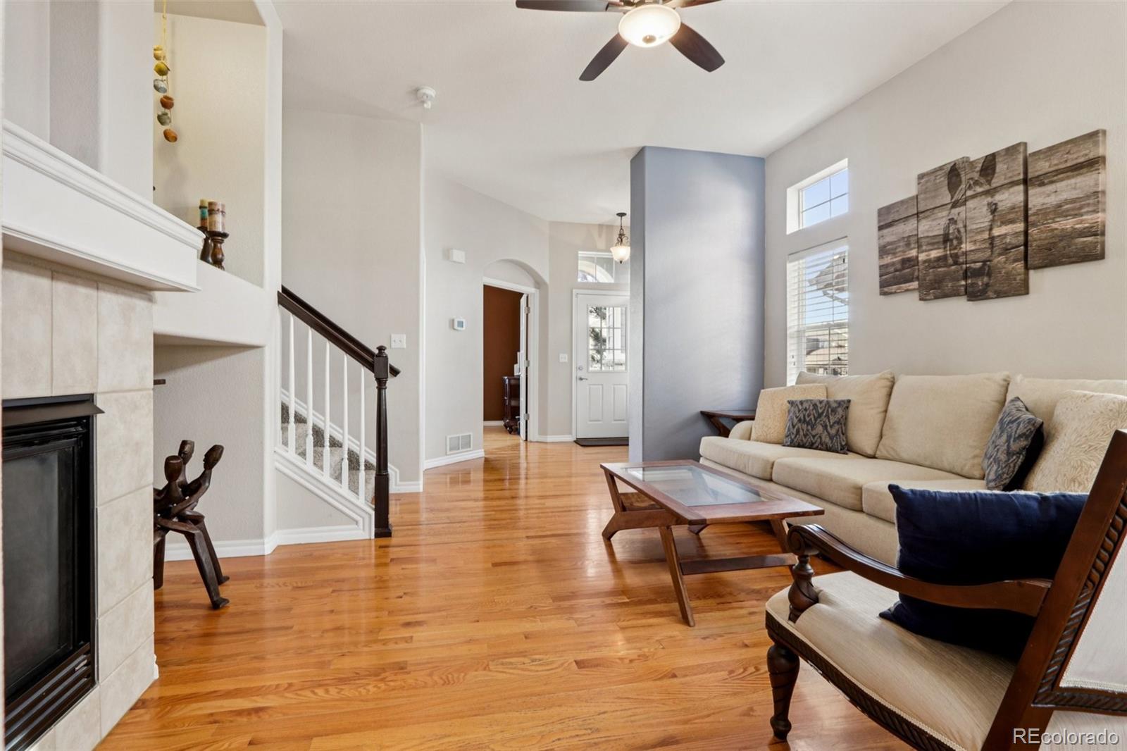 3120 Redhaven Way Highlands Ranch, CO 80126 - Photo 3 of 50 a living room with furniture and a wooden floor