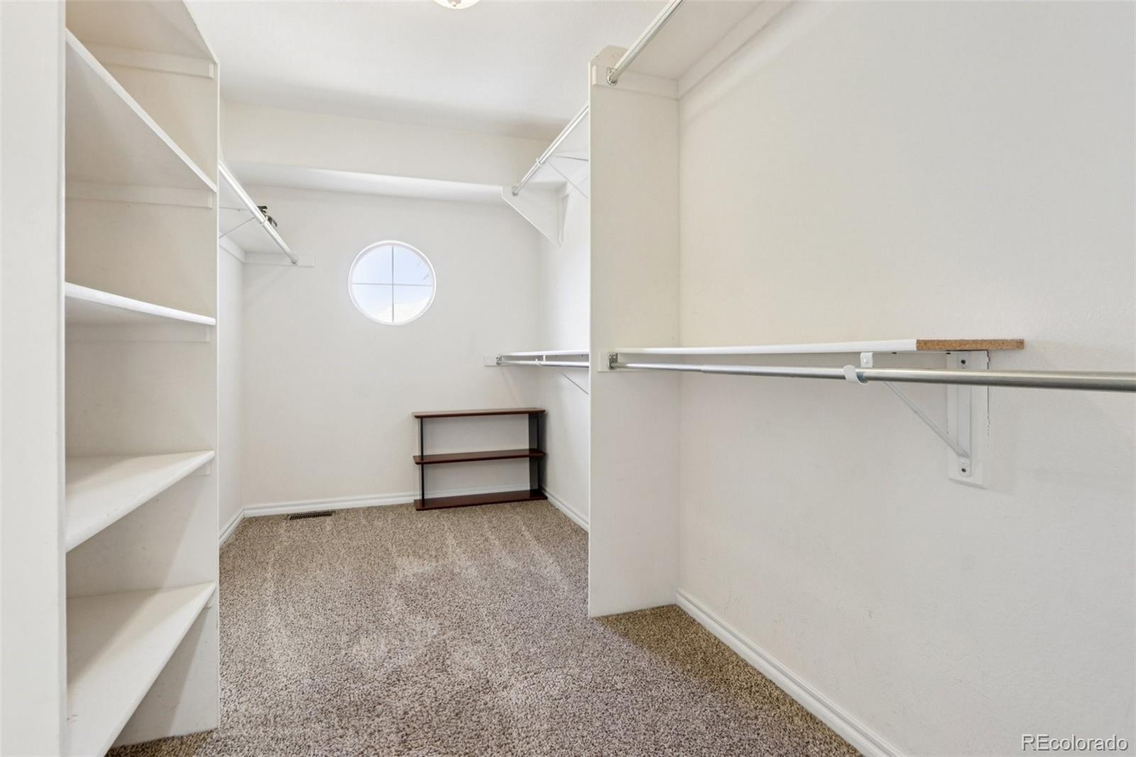 3120 Redhaven Way Highlands Ranch, CO 80126 - Photo 35 of 50 a view of a room with racks on the wall