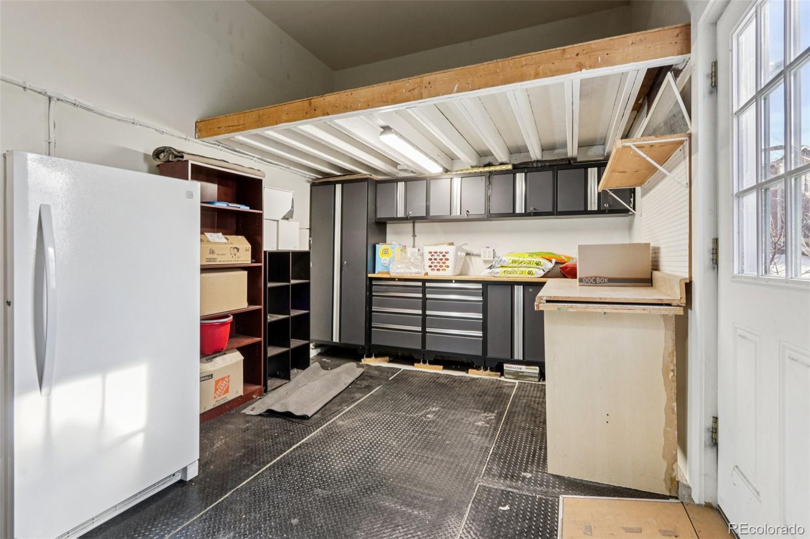 3120 Redhaven Way Highlands Ranch, CO 80126 - Photo 43 of 50 a view of storage and utility room with a refrigerator