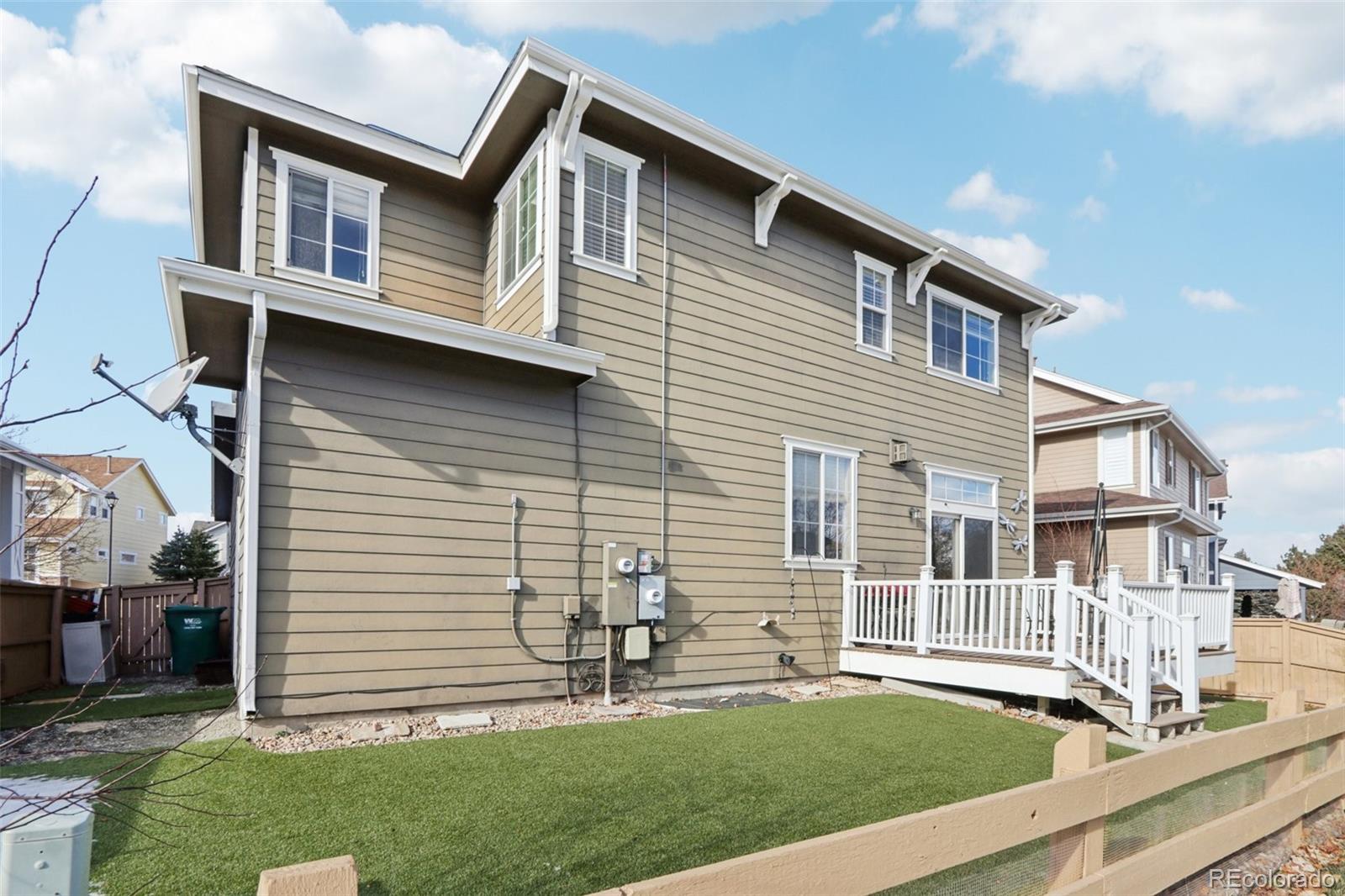 3120 Redhaven Way Highlands Ranch, CO 80126 - Photo 50 of 50 a front view of a house with a yard