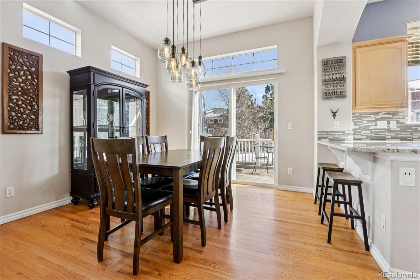 3120 Redhaven Way Highlands Ranch, CO 80126 - Photo 5 of 50 a view of a dining room with furniture window and wooden floor
