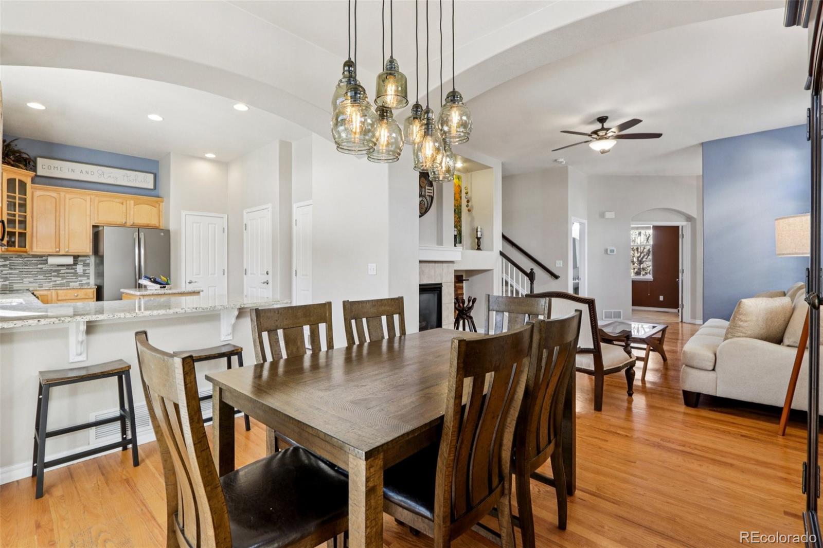 3120 Redhaven Way Highlands Ranch, CO 80126 - Photo 7 of 50 a view of a a dining room with furniture window and wooden floor