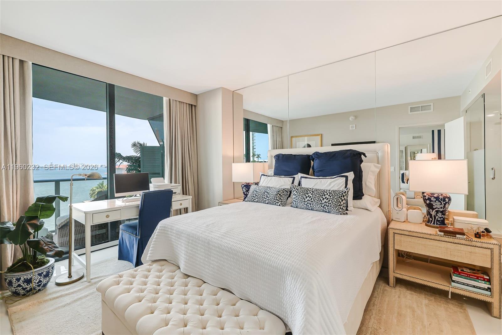 460 Northeast 28th Street, Unit 704 Miami, FL 33137 - Photo 23 of 53 a bedroom with a bed and large windows