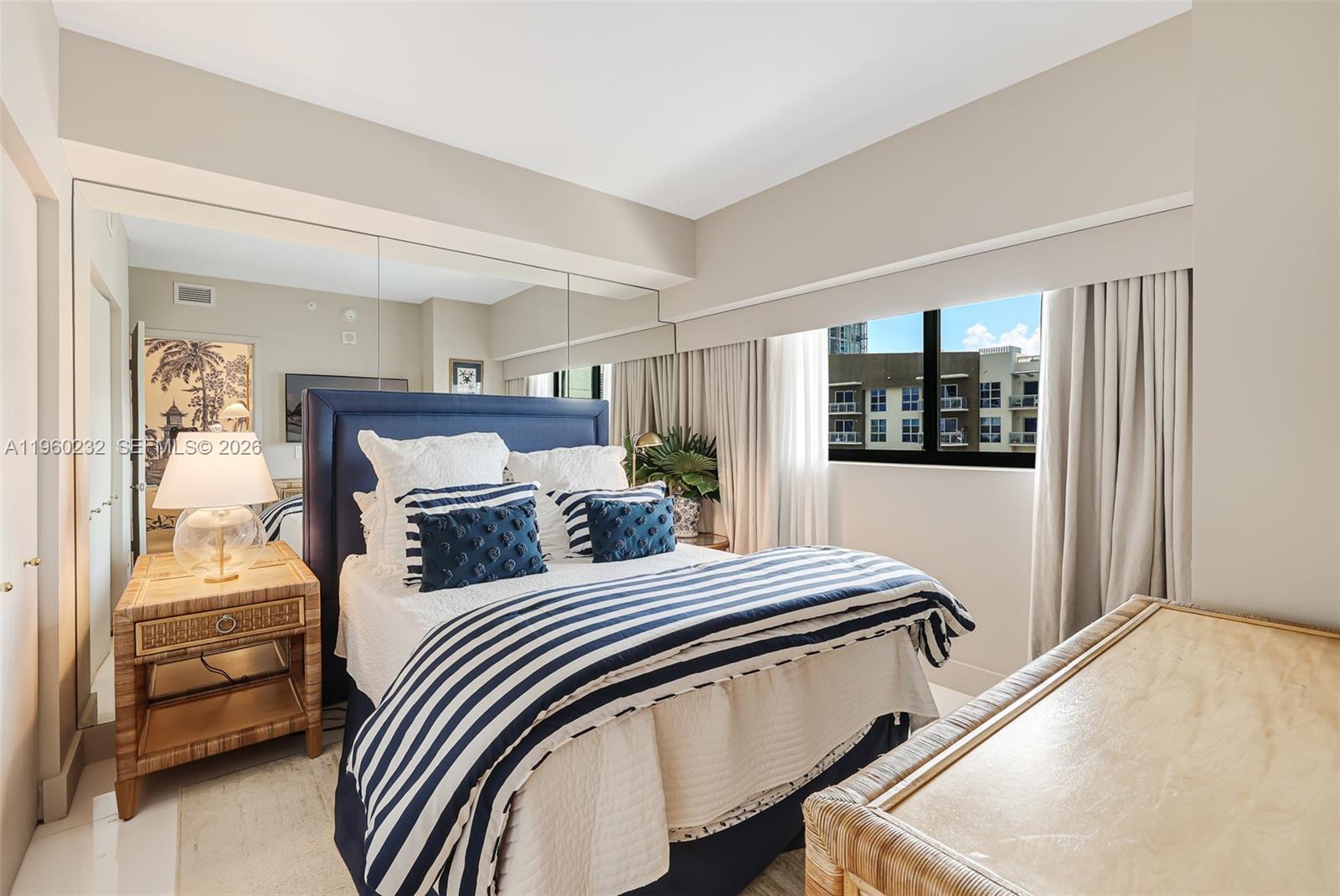 460 Northeast 28th Street, Unit 704 Miami, FL 33137 - Photo 34 of 53 a bedroom with a bed and a dresser