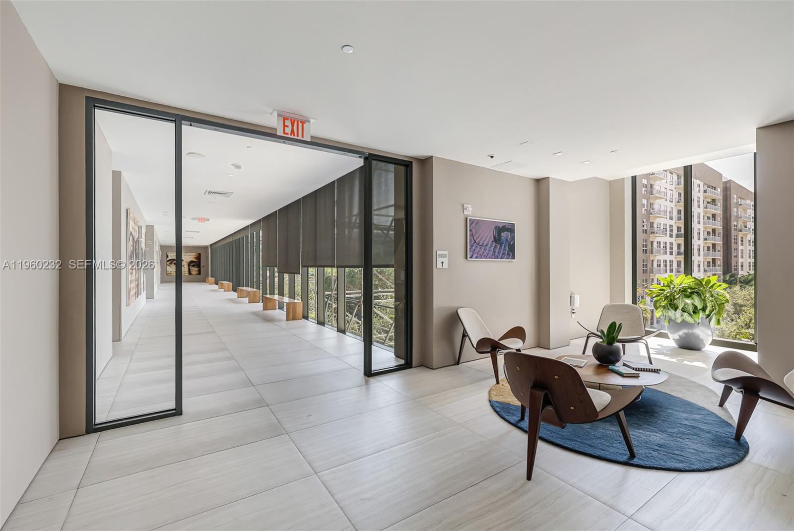 460 Northeast 28th Street, Unit 704 Miami, FL 33137 - Photo 43 of 53 a living room with furniture and a potted plant