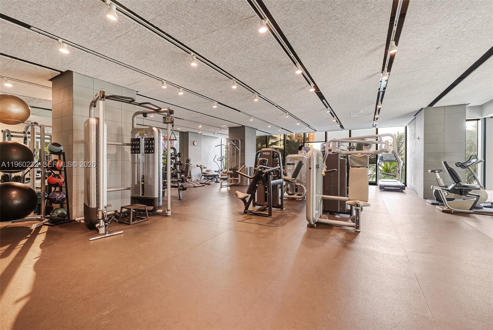 460 Northeast 28th Street, Unit 704 Miami, FL 33137 - Photo 44 of 53 a view of a room with gym equipment