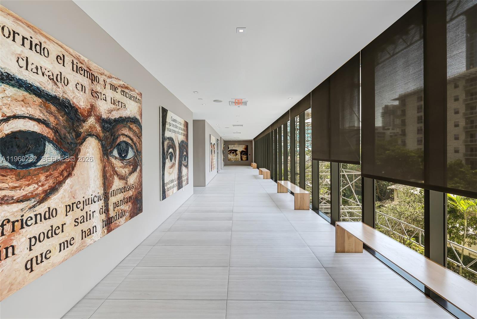 460 Northeast 28th Street, Unit 704 Miami, FL 33137 - Photo 45 of 53 a hallway with a large window and a white door