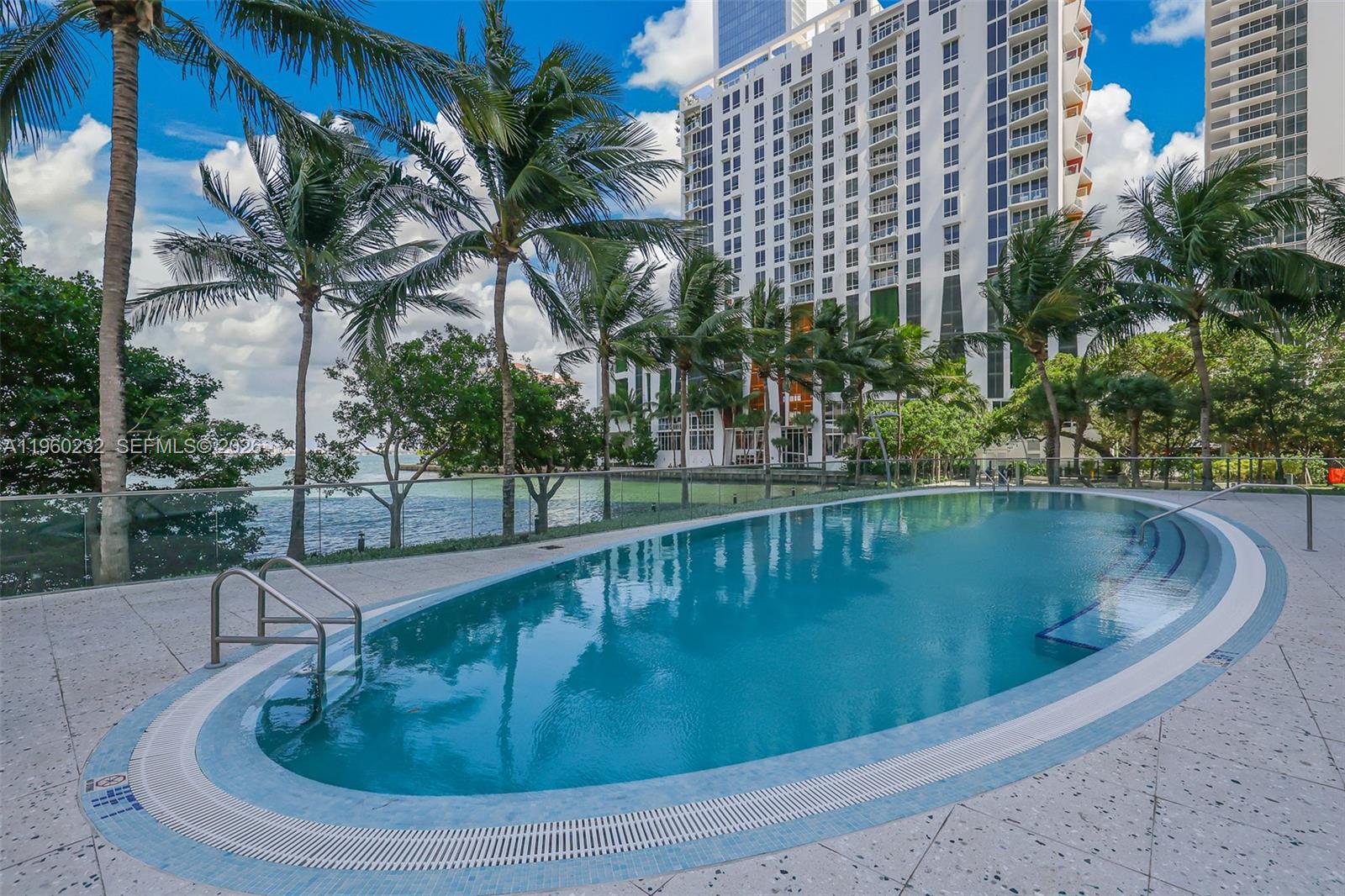460 Northeast 28th Street, Unit 704 Miami, FL 33137 - Photo 47 of 53 a view of swimming pool with outdoor seating and plants