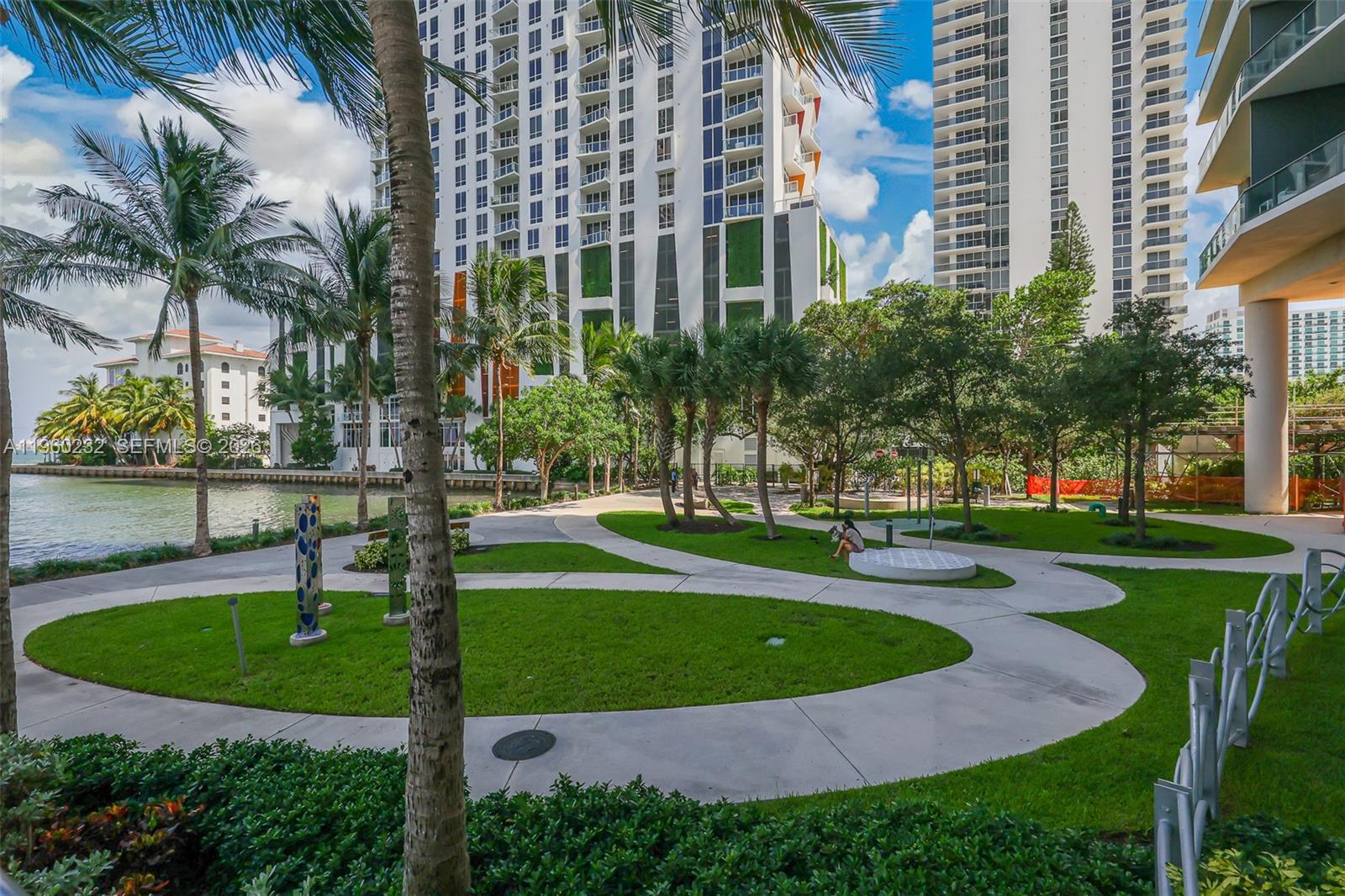 460 Northeast 28th Street, Unit 704 Miami, FL 33137 - Photo 50 of 53 a view of a swimming pool with a garden