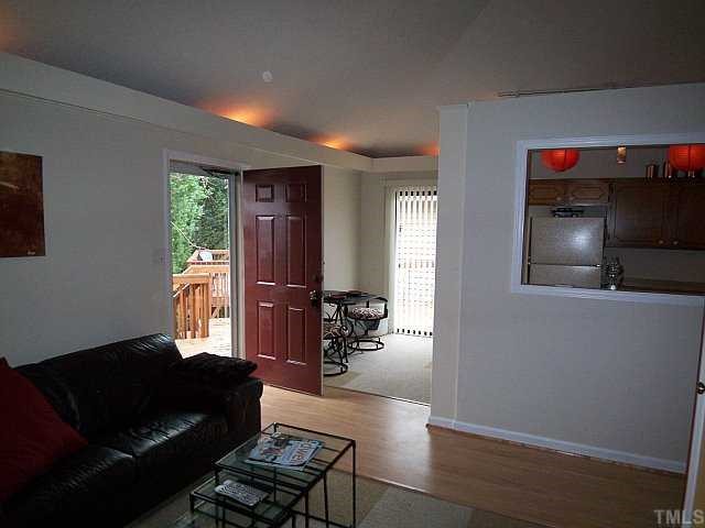 3320 Mill Run Raleigh, NC 27612 - Photo 4 of 10 a living room with furniture and a flat screen tv