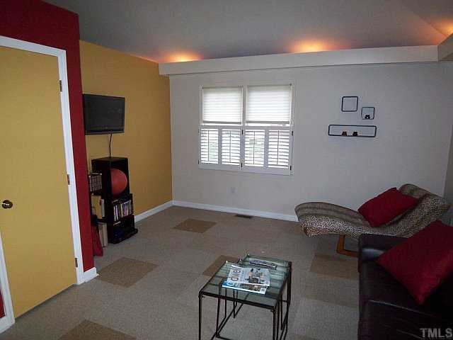 3320 Mill Run Raleigh, NC 27612 - Photo 7 of 10 a living room with furniture and a window