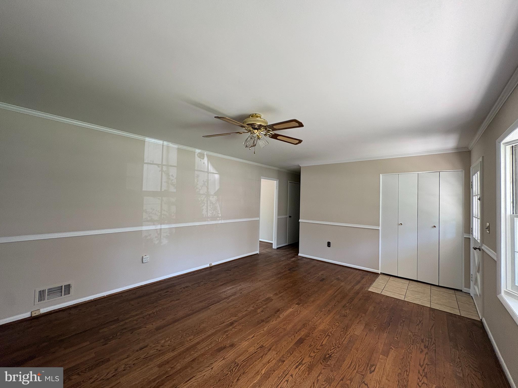 1554 Long Point Road Pasadena, MD 21122 - Photo 8 of 27 a view of an empty room with wooden floor
