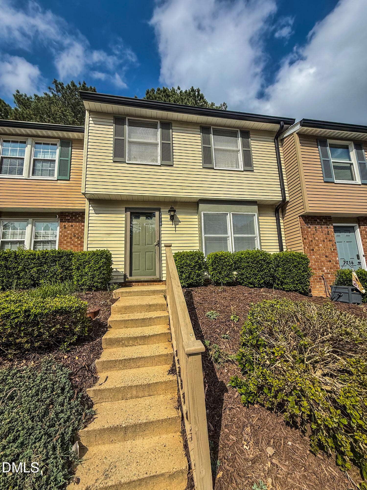 7718 Kelley Court Raleigh, NC 27615 - Photo 1 of 13 a front view of a house with a yard