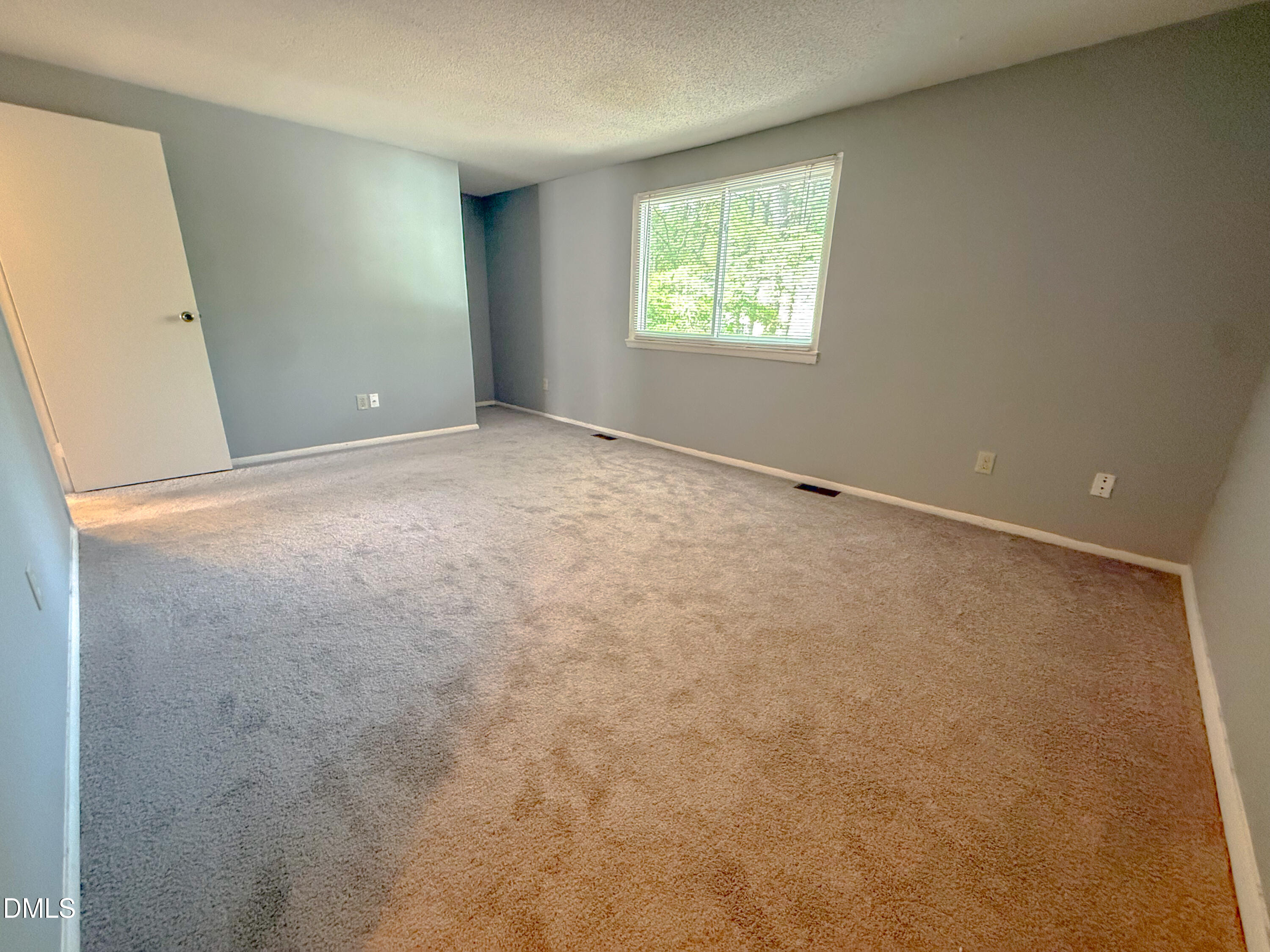 7718 Kelley Court Raleigh, NC 27615 - Photo 12 of 13 an empty room with windows