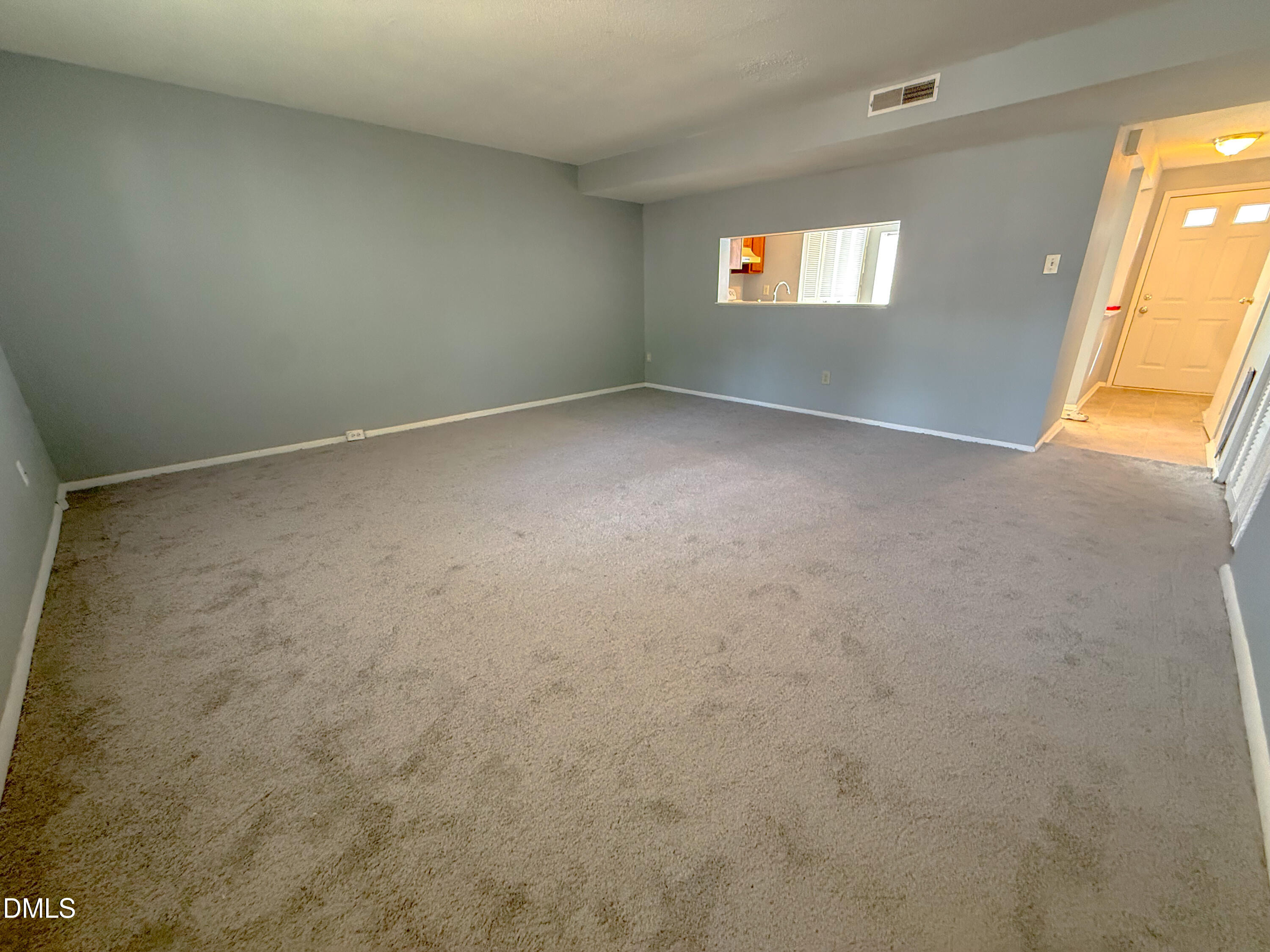 7718 Kelley Court Raleigh, NC 27615 - Photo 5 of 13 an empty room with windows