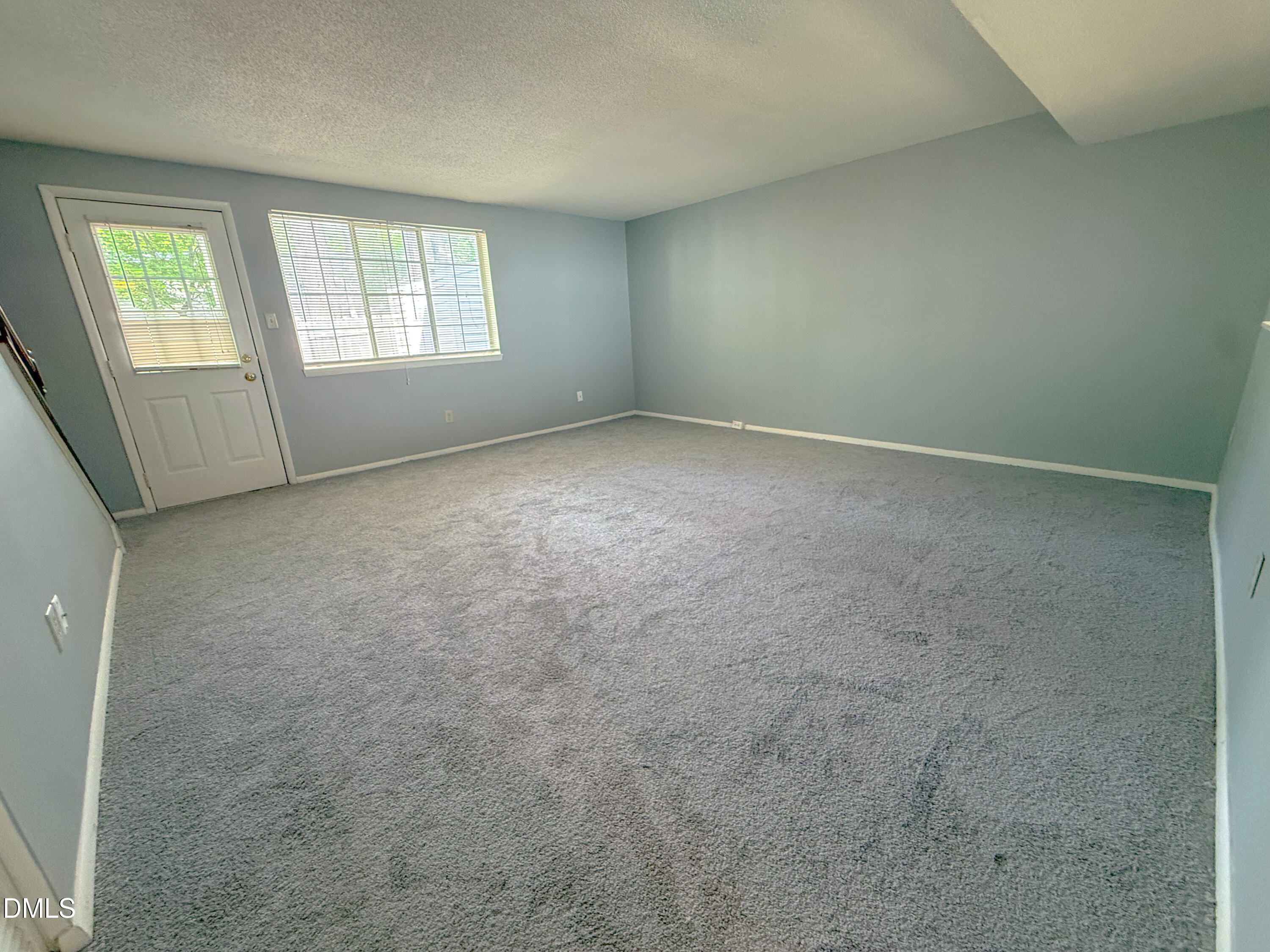 7718 Kelley Court Raleigh, NC 27615 - Photo 6 of 13 an empty room with windows