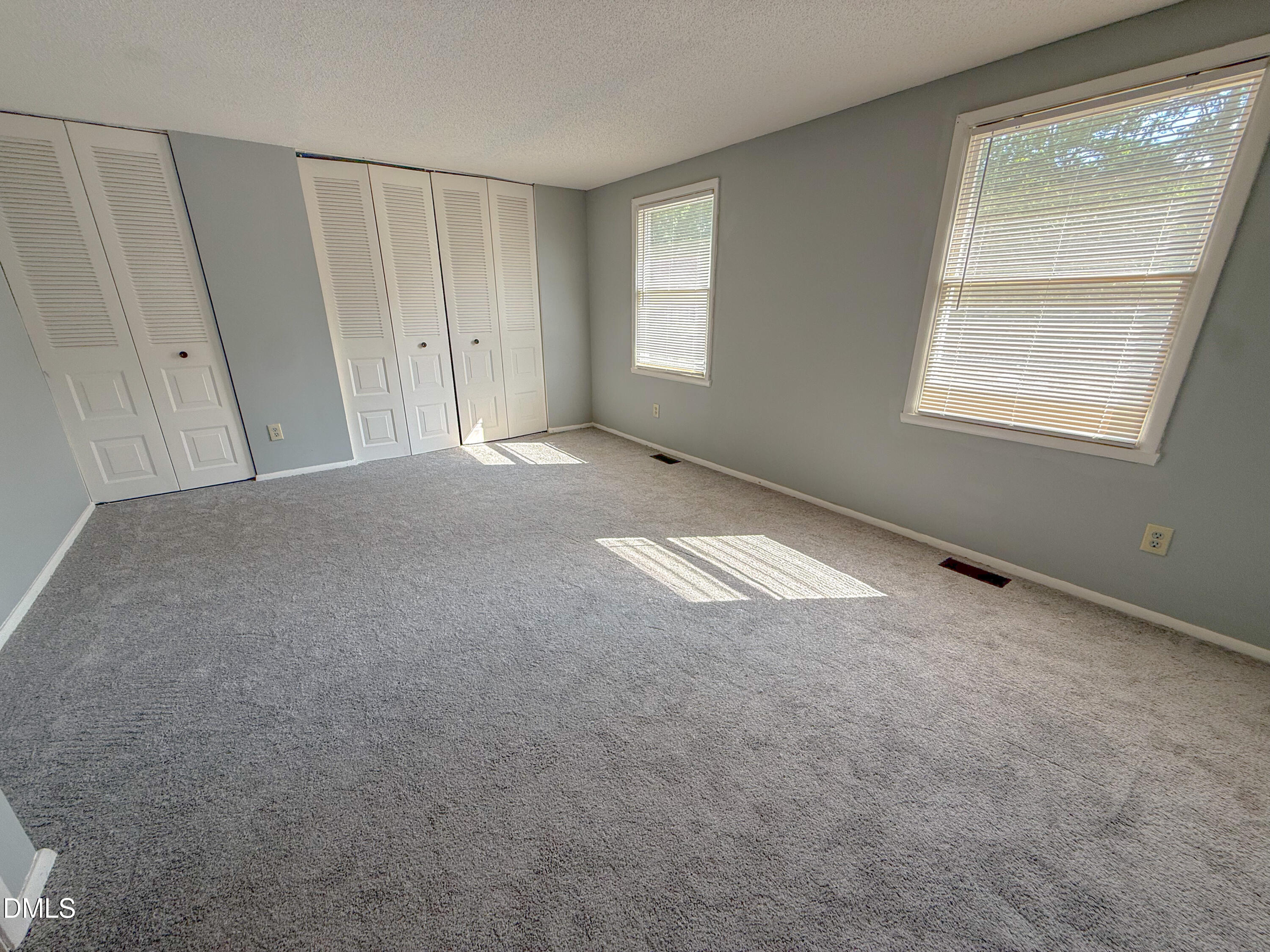 7718 Kelley Court Raleigh, NC 27615 - Photo 8 of 13 a view of empty room with window