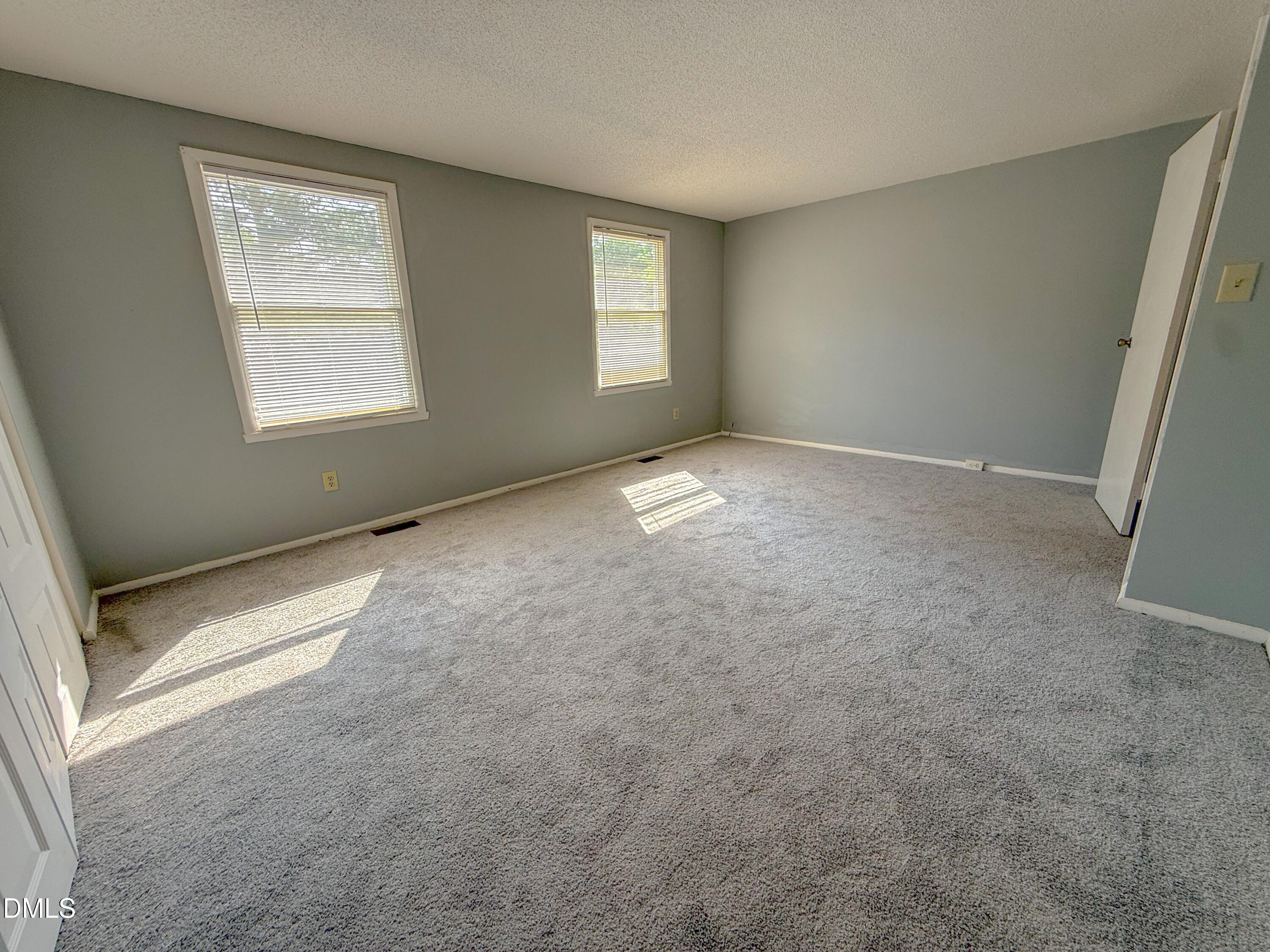7718 Kelley Court Raleigh, NC 27615 - Photo 9 of 13 an empty room with windows