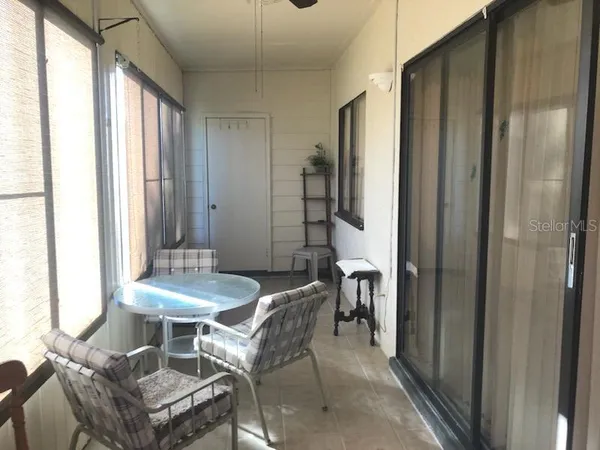 a dining room with furniture and a window