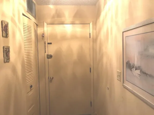 a bathroom with a glass shower door