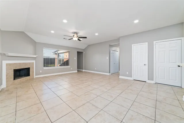 a view of an empty room with a fireplace
