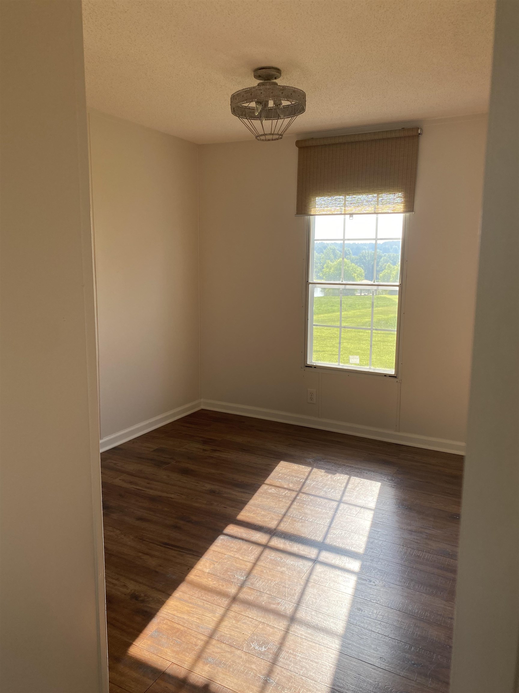3645 Pleasant Grove Road Moscow, TN 38057 - Photo 32 of 39 Empty room featuring dark wood-type flooring