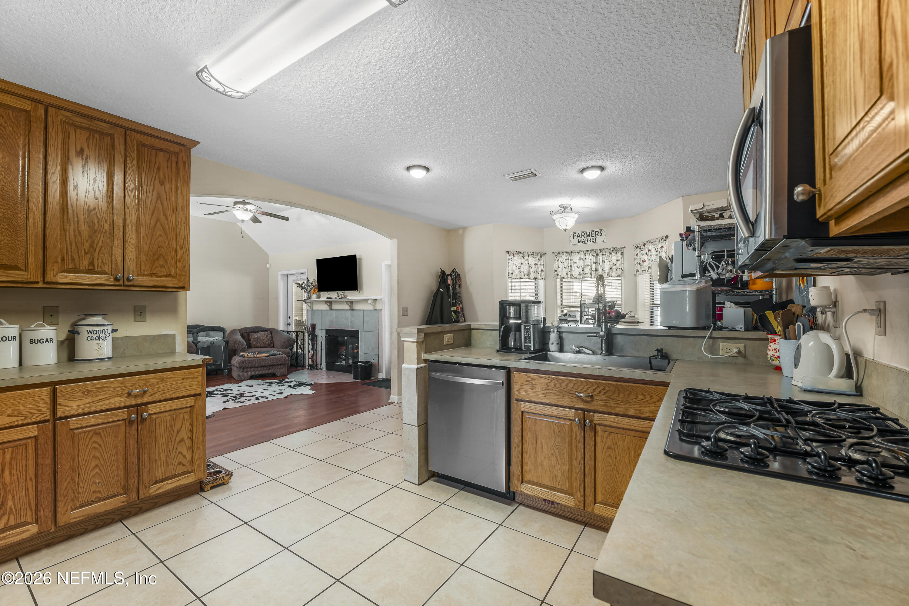 1725 Davidson Farm Road Jacksonville, FL 32218 - Photo 25 of 55 a kitchen with a sink and cabinets