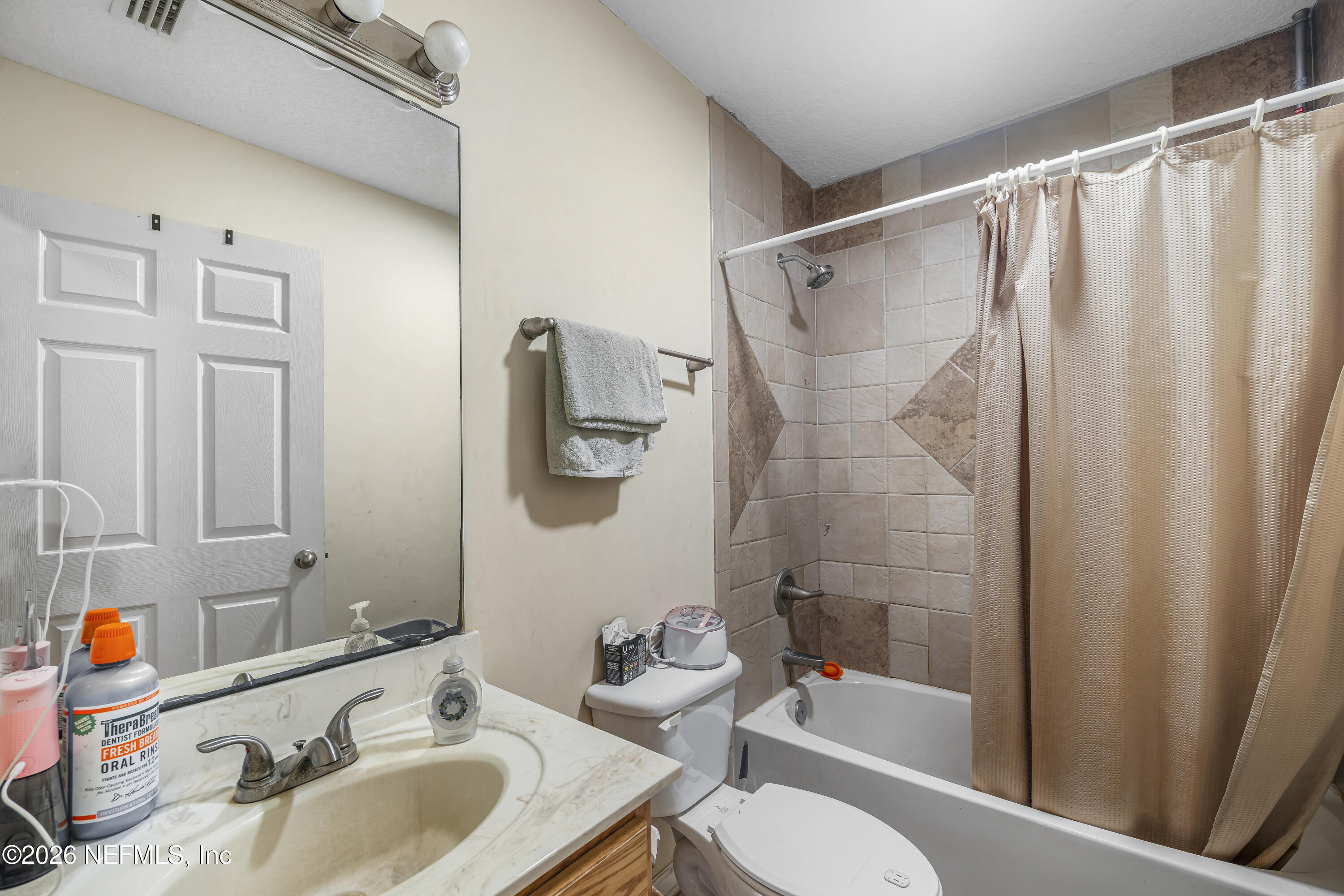 1725 Davidson Farm Road Jacksonville, FL 32218 - Photo 40 of 55 a bathroom with a sink toilet and shower