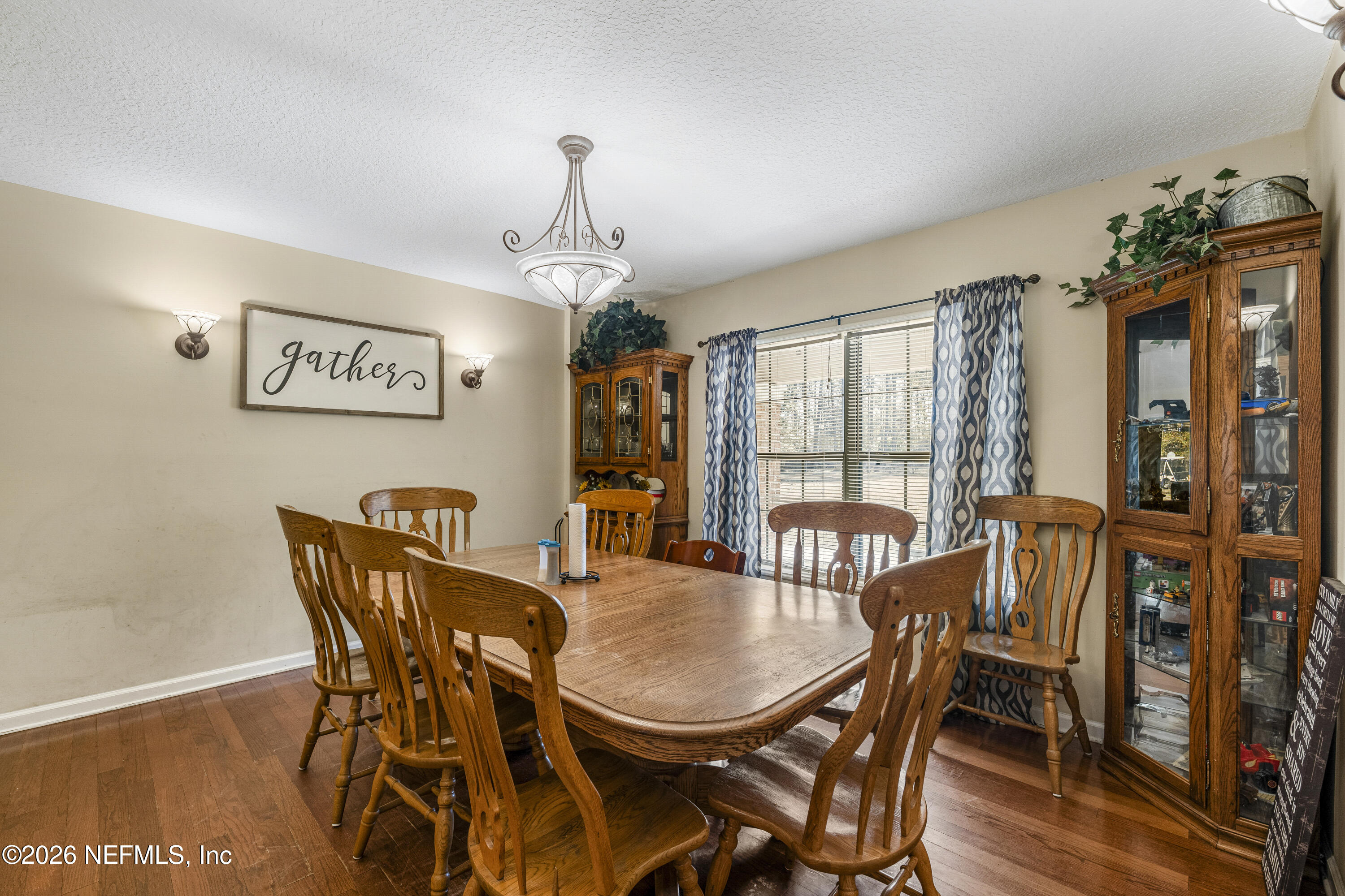 1725 Davidson Farm Road Jacksonville, FL 32218 - Photo 4 of 55 a view of a dining room with furniture window and wooden floor