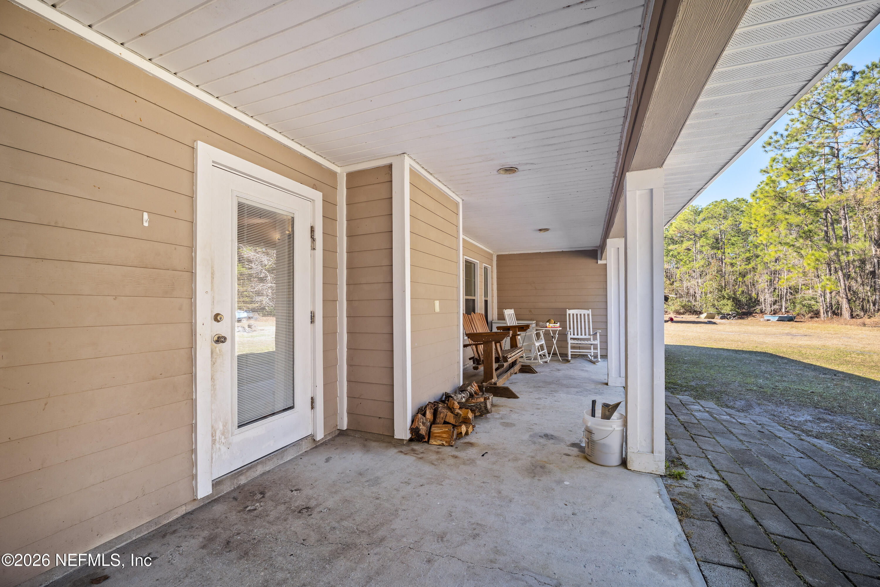 1725 Davidson Farm Road Jacksonville, FL 32218 - Photo 45 of 55 a view of a room with furniture and floor to ceiling window