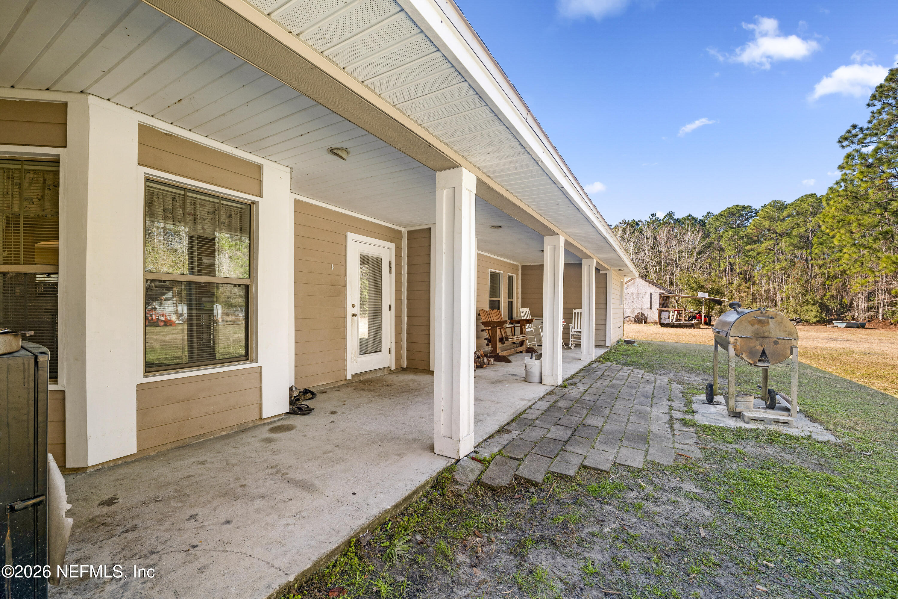 1725 Davidson Farm Road Jacksonville, FL 32218 - Photo 46 of 55 a view of a house with a yard