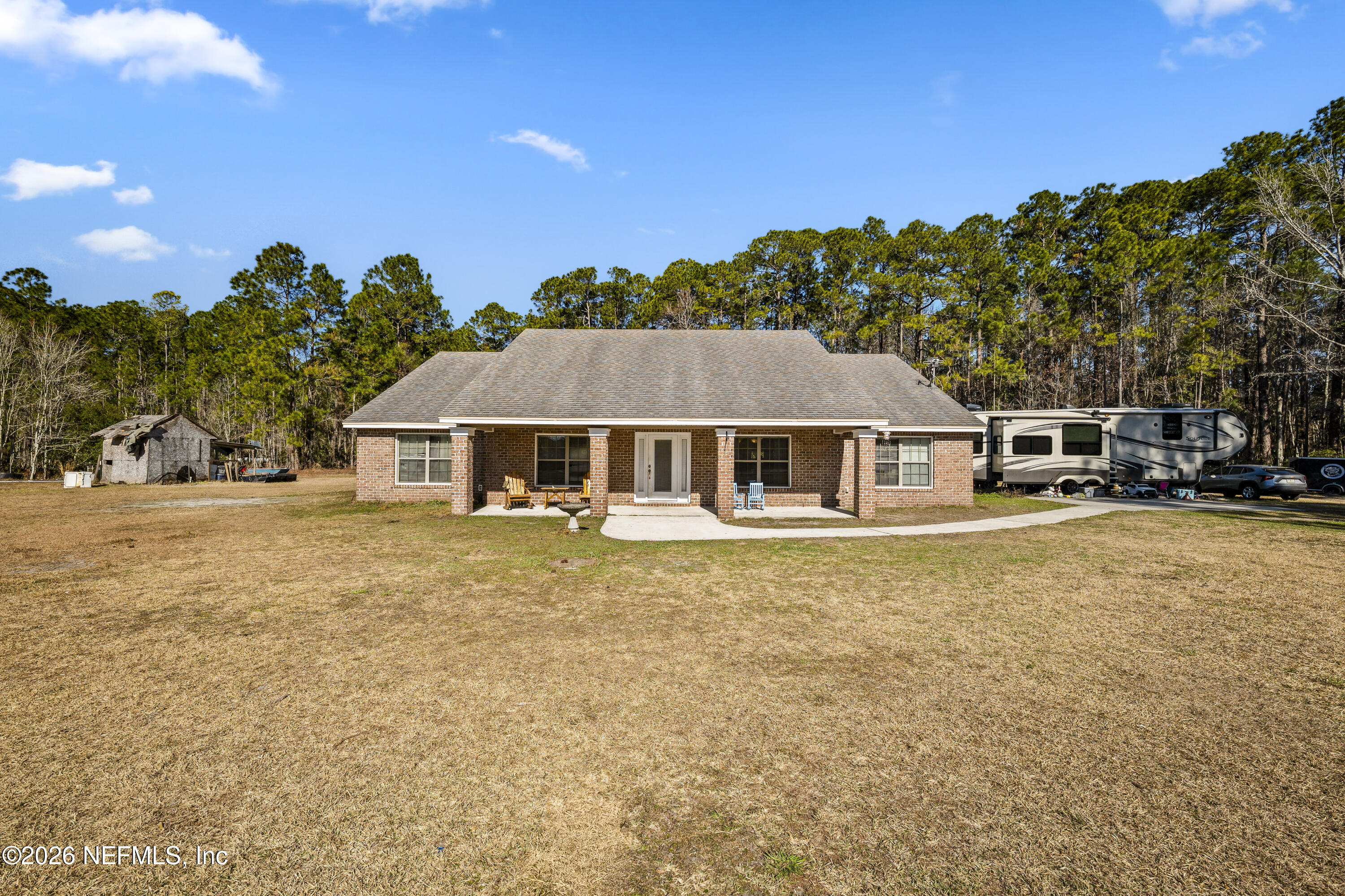 1725 Davidson Farm Road Jacksonville, FL 32218 - Photo 55 of 55 a front view of a house with a garden
