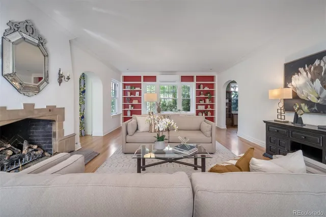 a living room with furniture and a fireplace