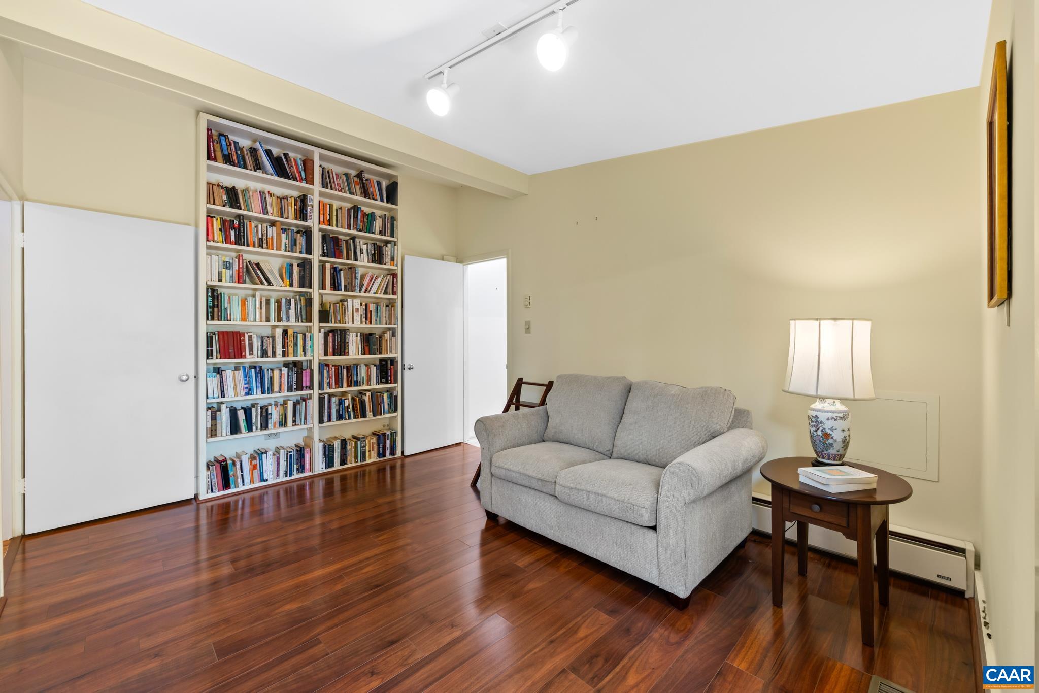 7098 Bucks Elbow Mountain Road Crozet, VA 22932 - Photo 31 of 57 a living room with furniture and a wooden floor