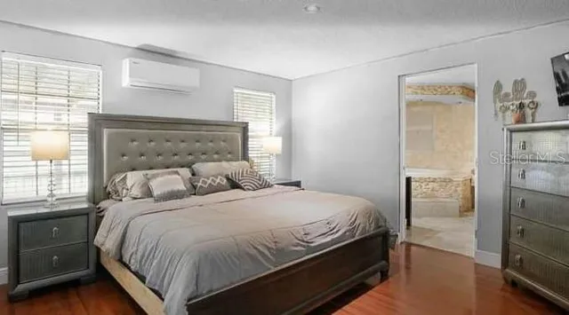 a bedroom with a bed and a cabinets