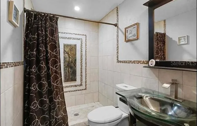 a bathroom with a sink and toilet